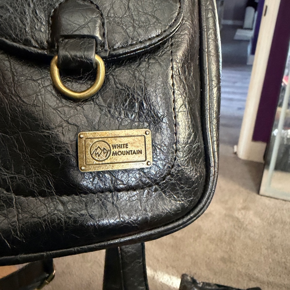 White Mountain Black Leather Backpack with Gold Accents